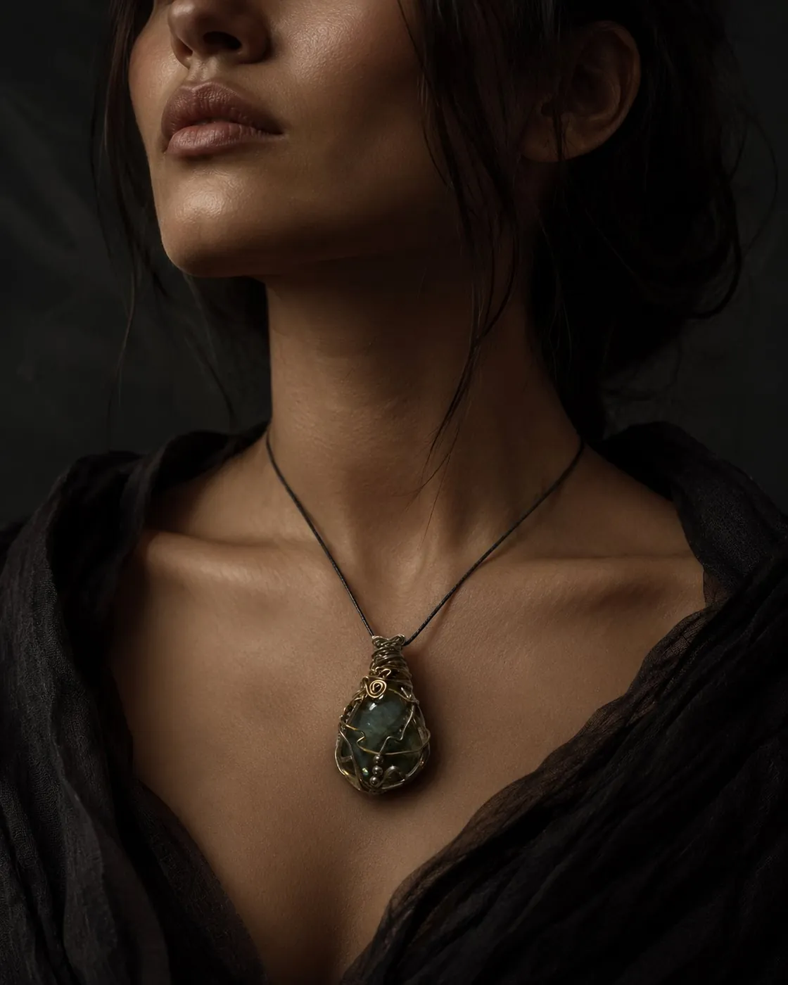 Wenu Mapu — labradorite wire-wrapped amulet worn at the throat