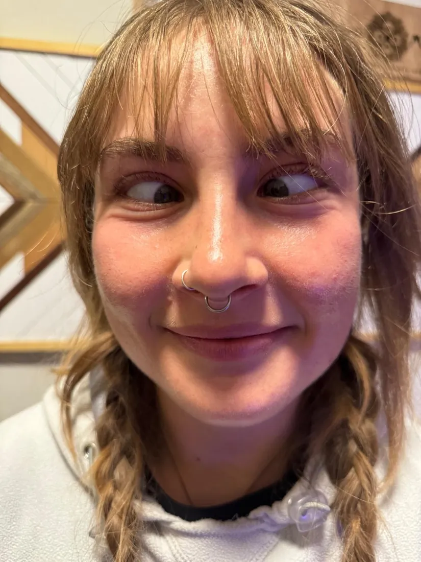 Septum piercing with a fine silver ring, placed by hand